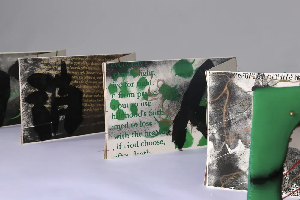 Folded pages with overprinted text, ink and green marks