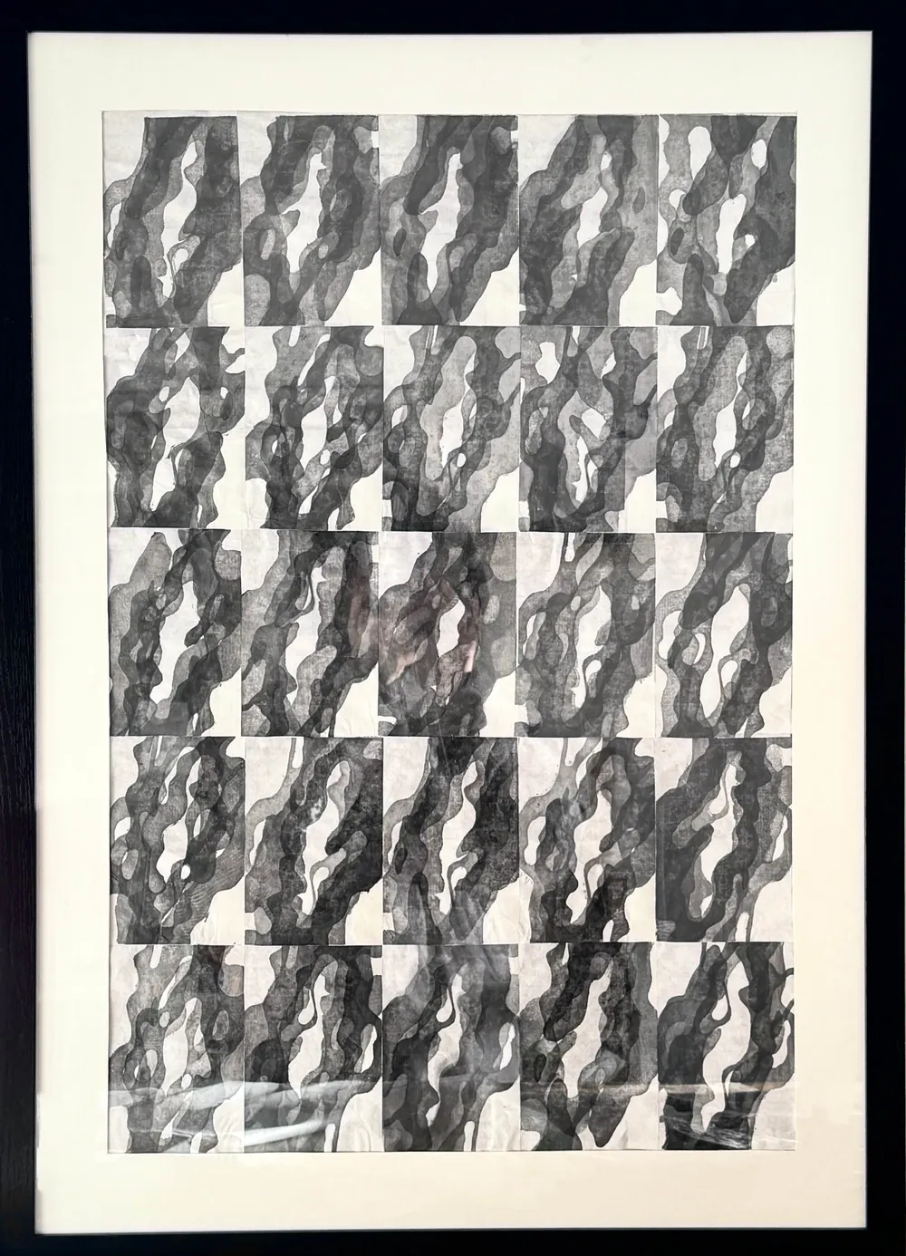 Shape of Stone: a repeated grid of printed stone forms, framed