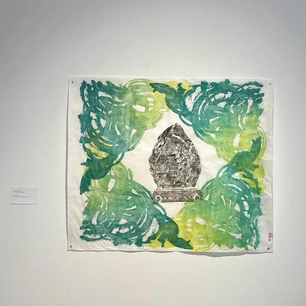 The Peach: green and yellow printed ground surrounding a central stone form